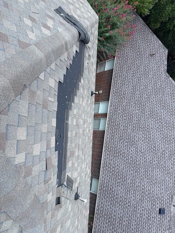 Looking down a roof valley where it meets the wall