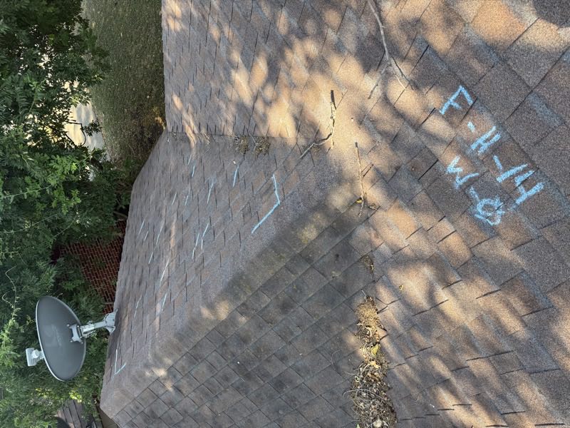 Adjuster chalk markings around a satellite mount