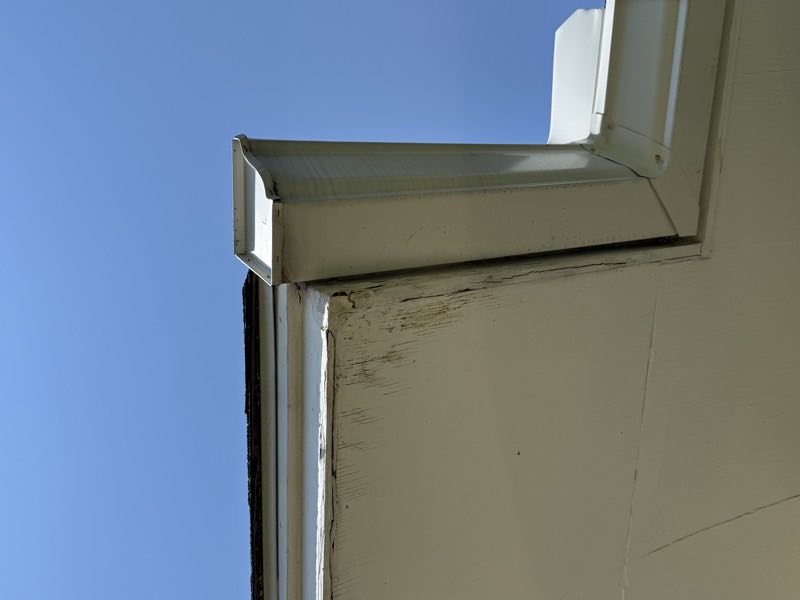 Water staining across a commercial fascia and soffit