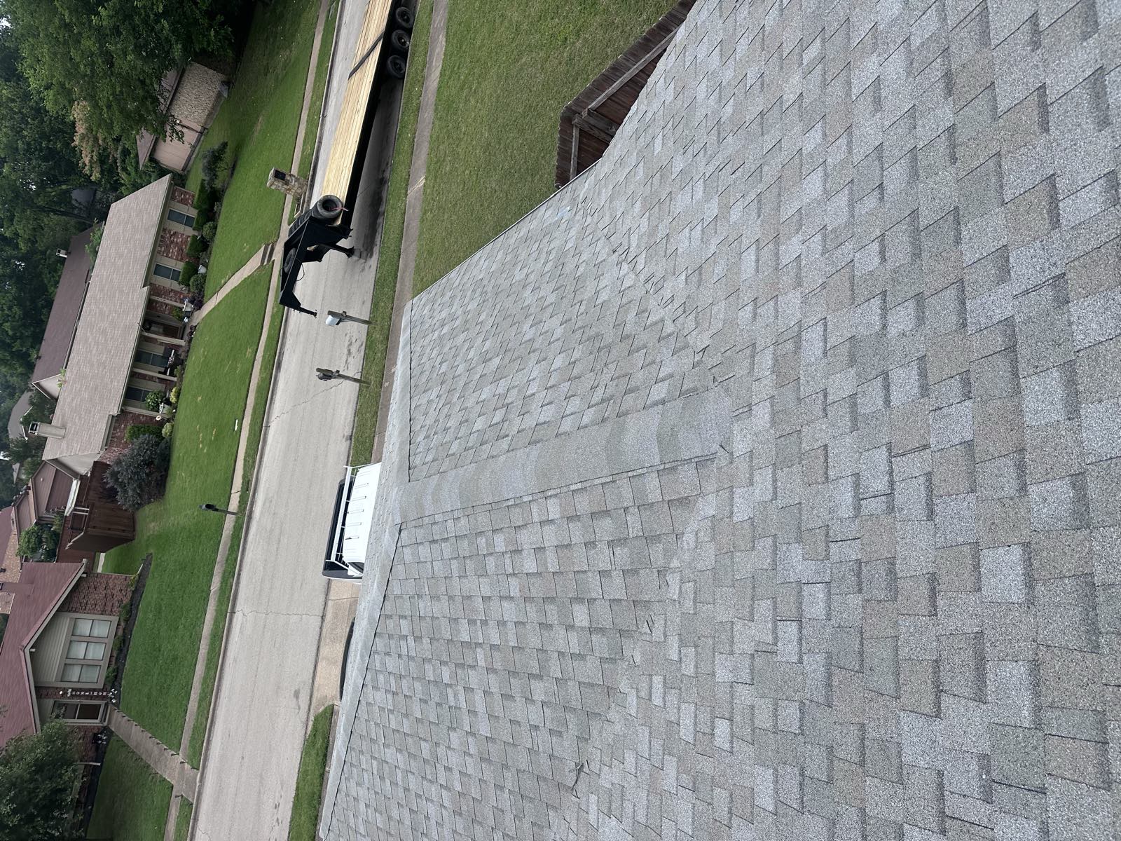 Job site with the truck and trailer at the curb