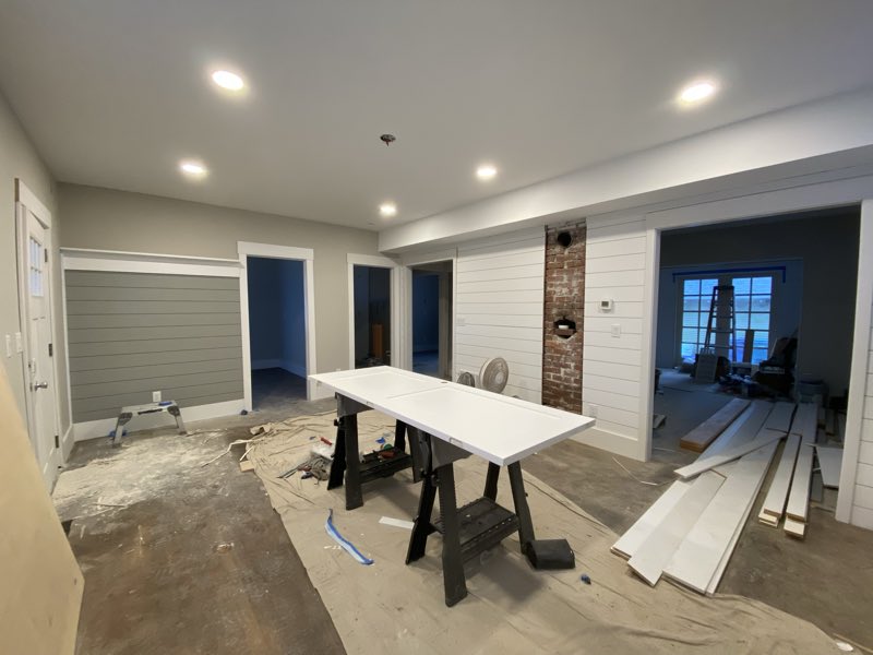 Shiplap and brick column in an opened up room